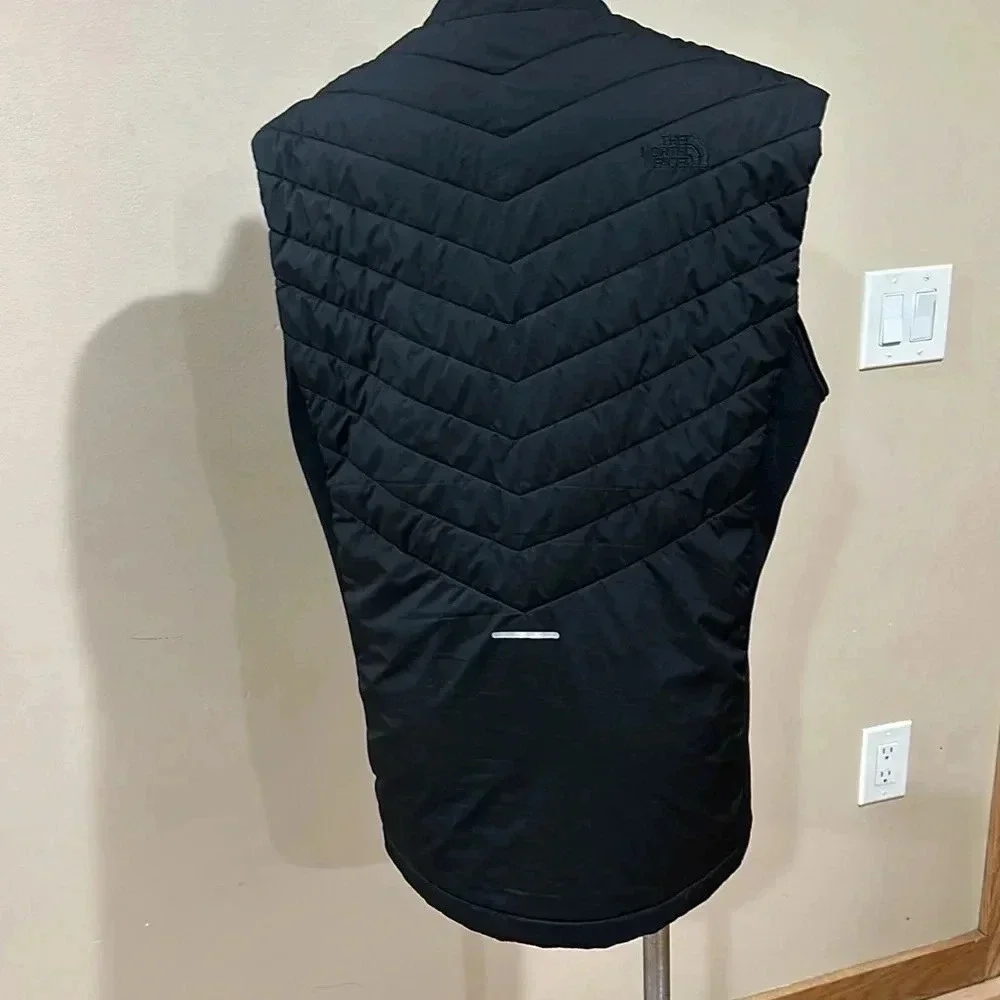 The North Face black puffer vest full front zip, pockets, front and back logo